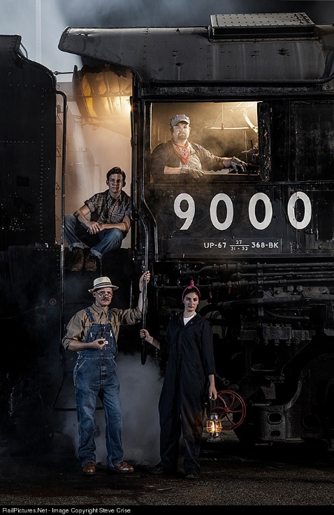 Four People Standing By A Train